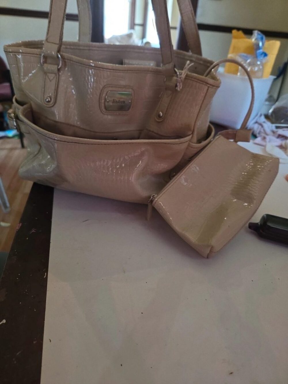 cream-colored, crocodile-embossed shoulder handbag
